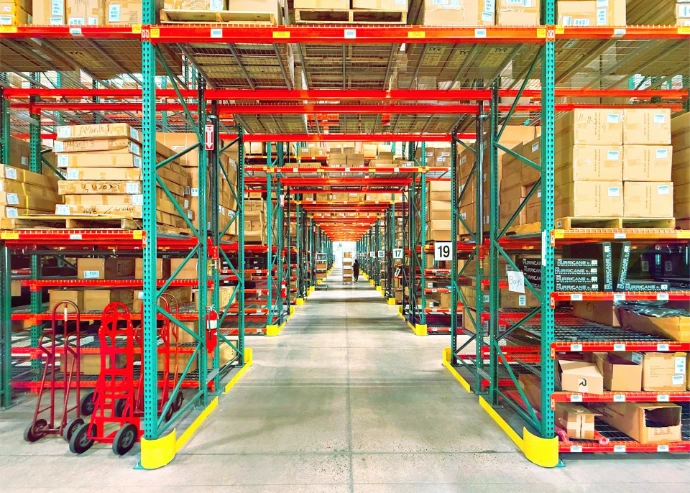 A warehouse is filled with shelves and boxes